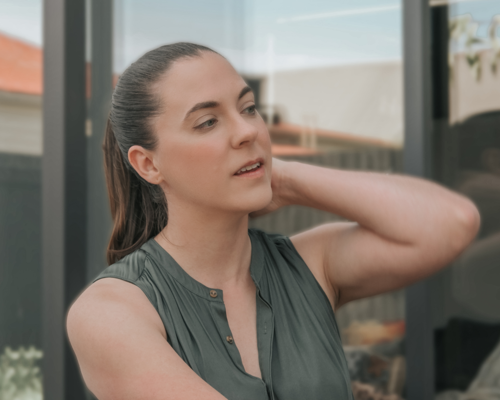 Jenn Kane sitting, looking to the right