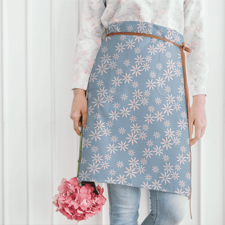 Blue floral apron on model