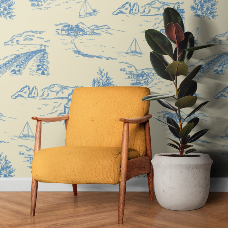 Coastal toile wallpaper mockup with blue Mediterranean landscape illustrations, sailboats, and seaside motifs in a modern interior