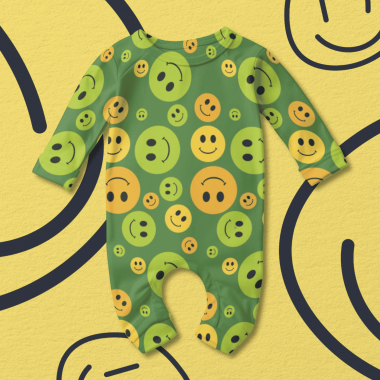 Baby romper with yellow smiley face pattern