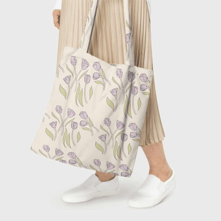 Person holding floral tote bag