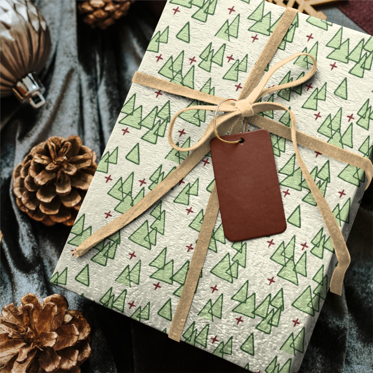Wrapped gifts with green tree pattern and pinecones
