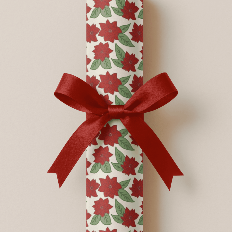 Wrapped gift with red ribbon and floral wrap